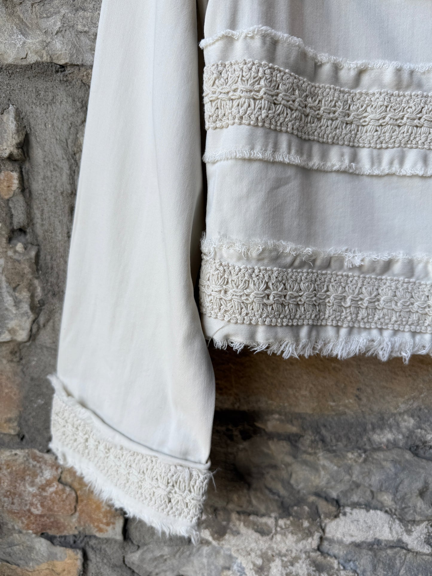 Collarless Stretch Jean Jacket with macrame frayed edges and pockets- Ivory